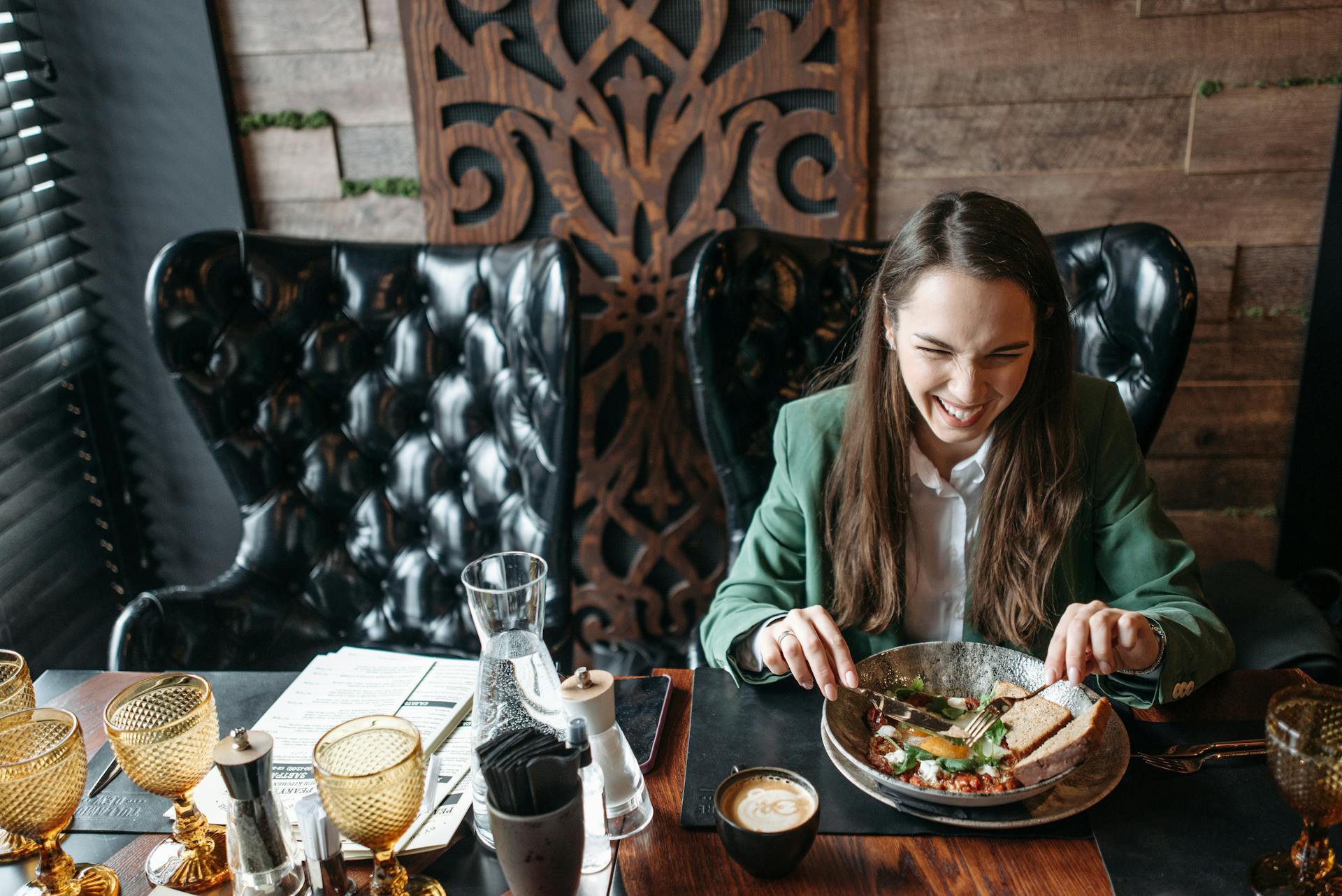 woman-laughing-enjoying-meal